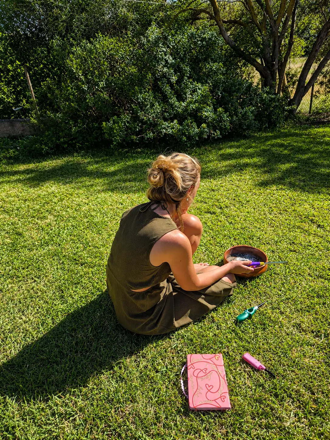 A quiet moment in the garden, sitting on the grass with a journal
